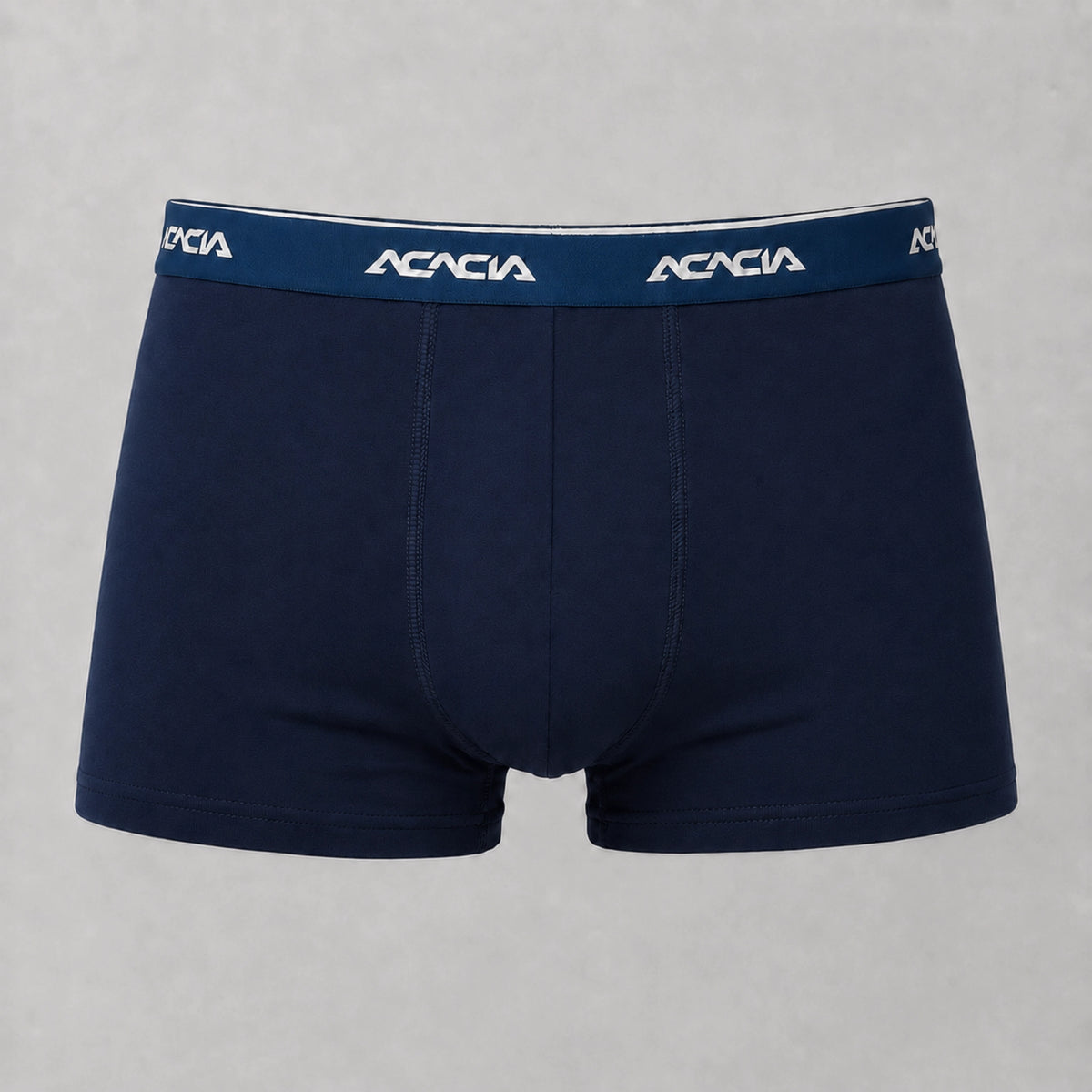 Front view of Acacia men’s dark navy trunks with short legs, a wide waistband, light-colored logos, and matching stitching.