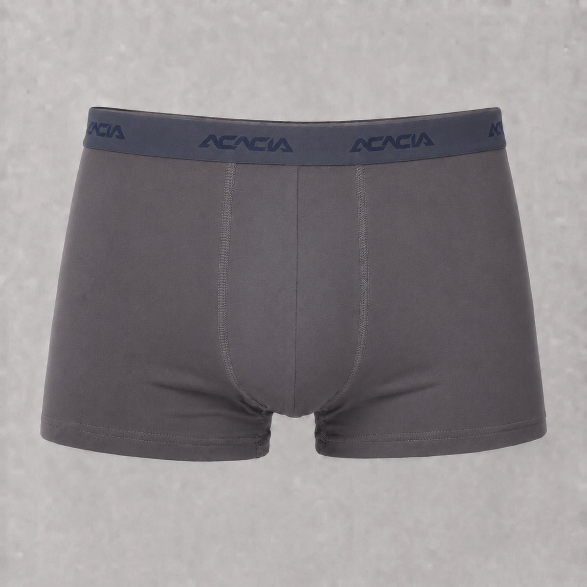 Front view of Acacia men’s grey trunks with short legs, a wide, darker waistband, navy logos, and matching front stitching.